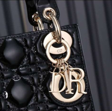 Christian Dior Mini Lady Dior bag in black patent leather with gold-finish metal D.I.O.R. charms