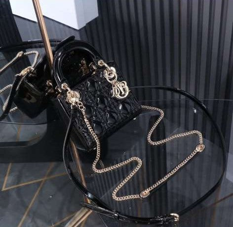 Christian Dior Mini Lady Dior bag in black patent leather with gold-finish metal D.I.O.R. charms