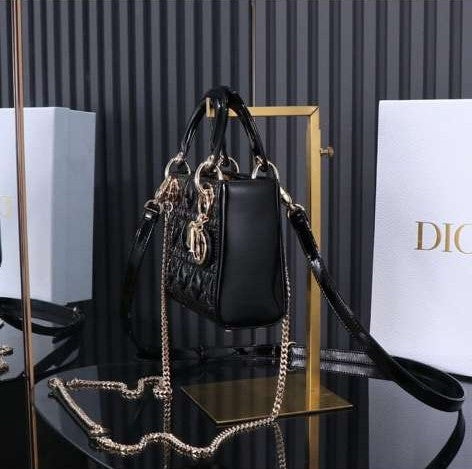 Christian Dior Mini Lady Dior bag in black patent leather with gold-finish metal D.I.O.R. charms