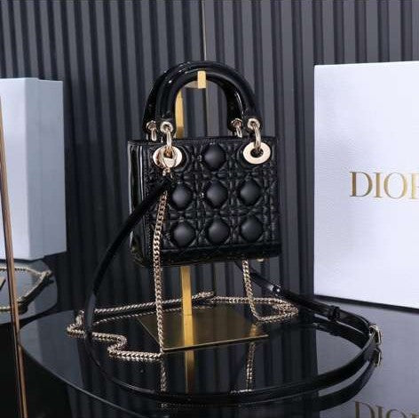 Christian Dior Mini Lady Dior bag in black patent leather with gold-finish metal D.I.O.R. charms