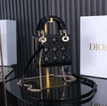 Christian Dior Mini Lady Dior bag in black patent leather with gold-finish metal D.I.O.R. charms