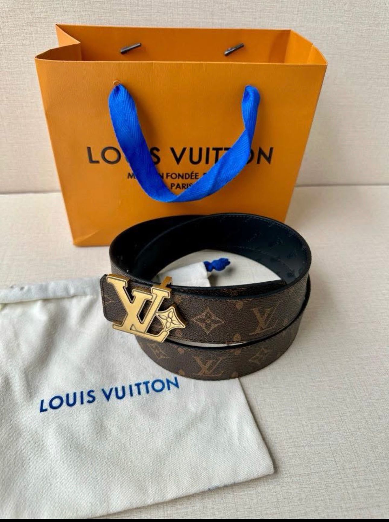 Louis Vuitton reversible belt, such as the Pretty LV or LV Initiales model
