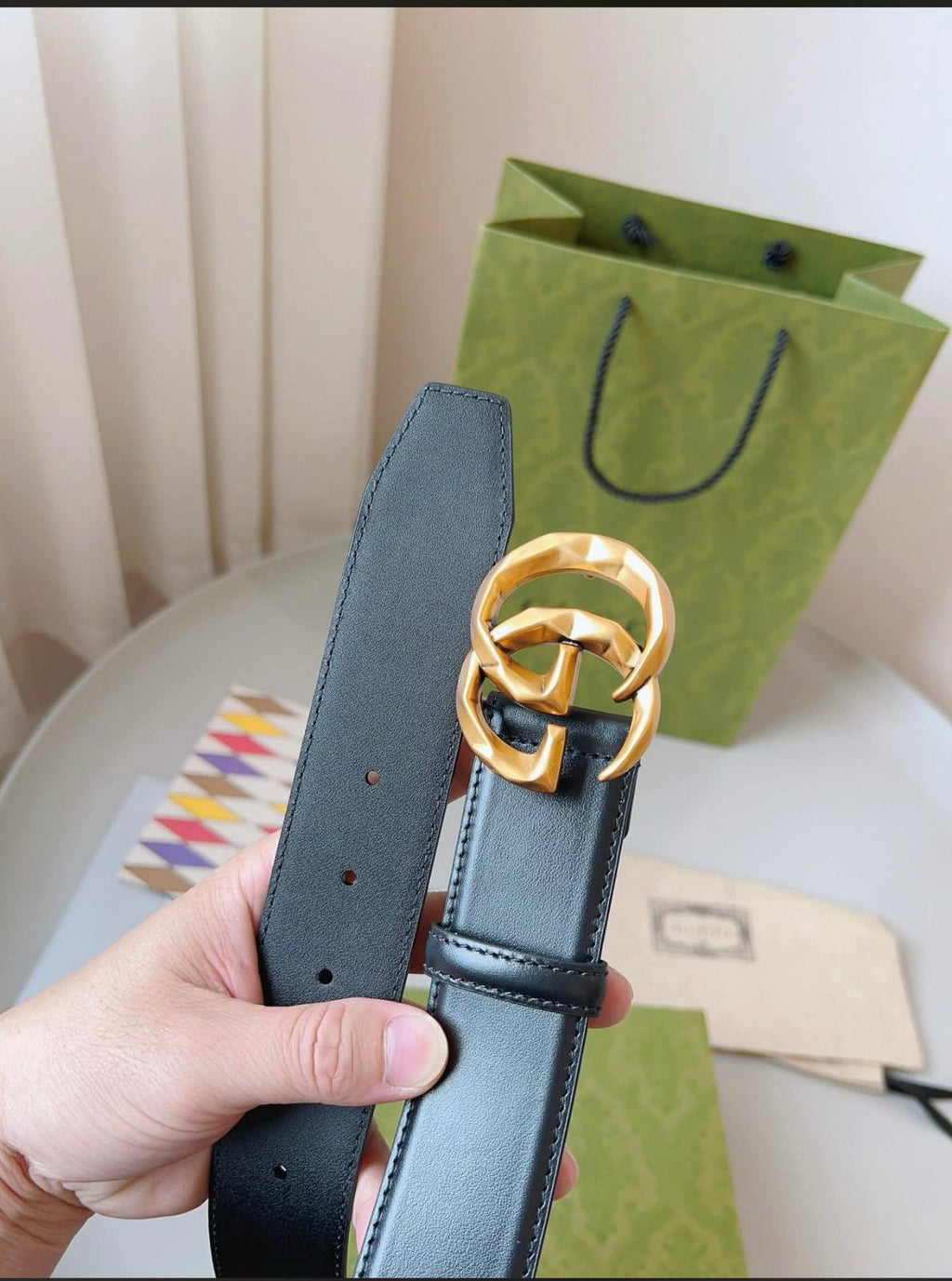 Gucci GG Marmont black leather belt with an aged gold-toned G buckle