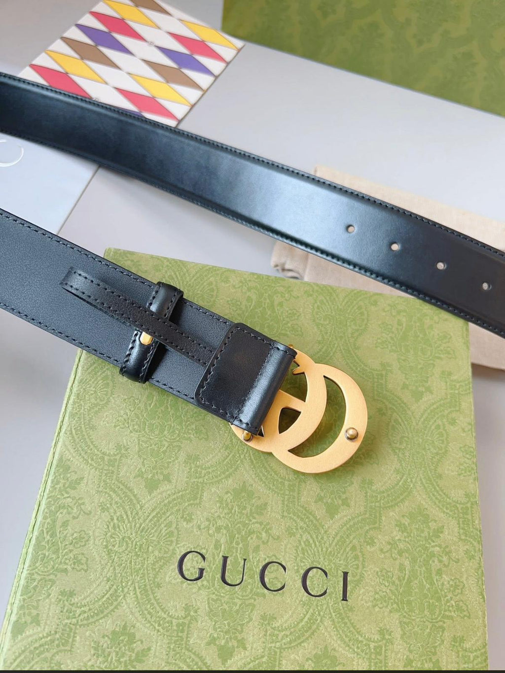 Gucci GG Marmont black leather belt with an aged gold-toned G buckle