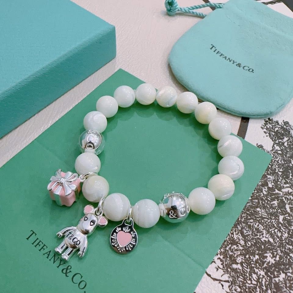 Tiffany & Co. 925 silver Ziegfeld white dolomite bracelet with additional charms