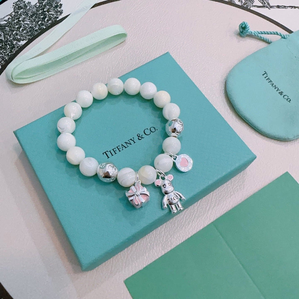 Tiffany & Co. 925 silver Ziegfeld white dolomite bracelet with additional charms