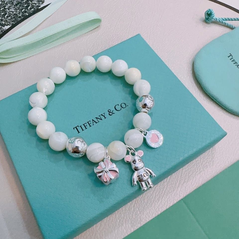 Tiffany & Co. 925 silver Ziegfeld white dolomite bracelet with additional charms